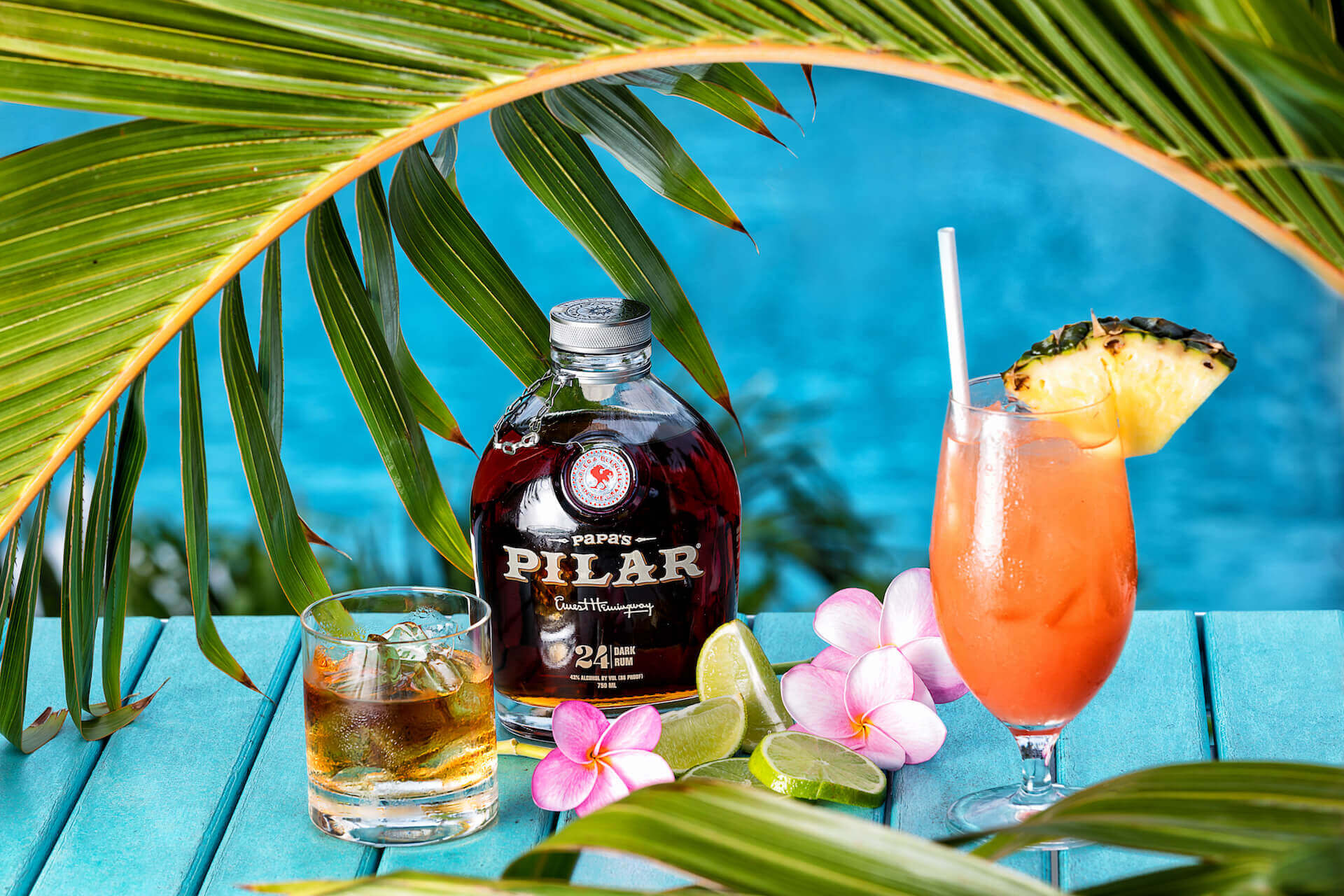 Tropical drinks on a table looking out into beautiful blue ocean